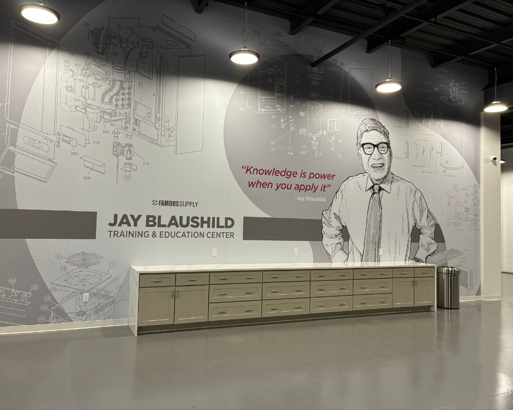 Famous Supply associate smiling in the warehouse